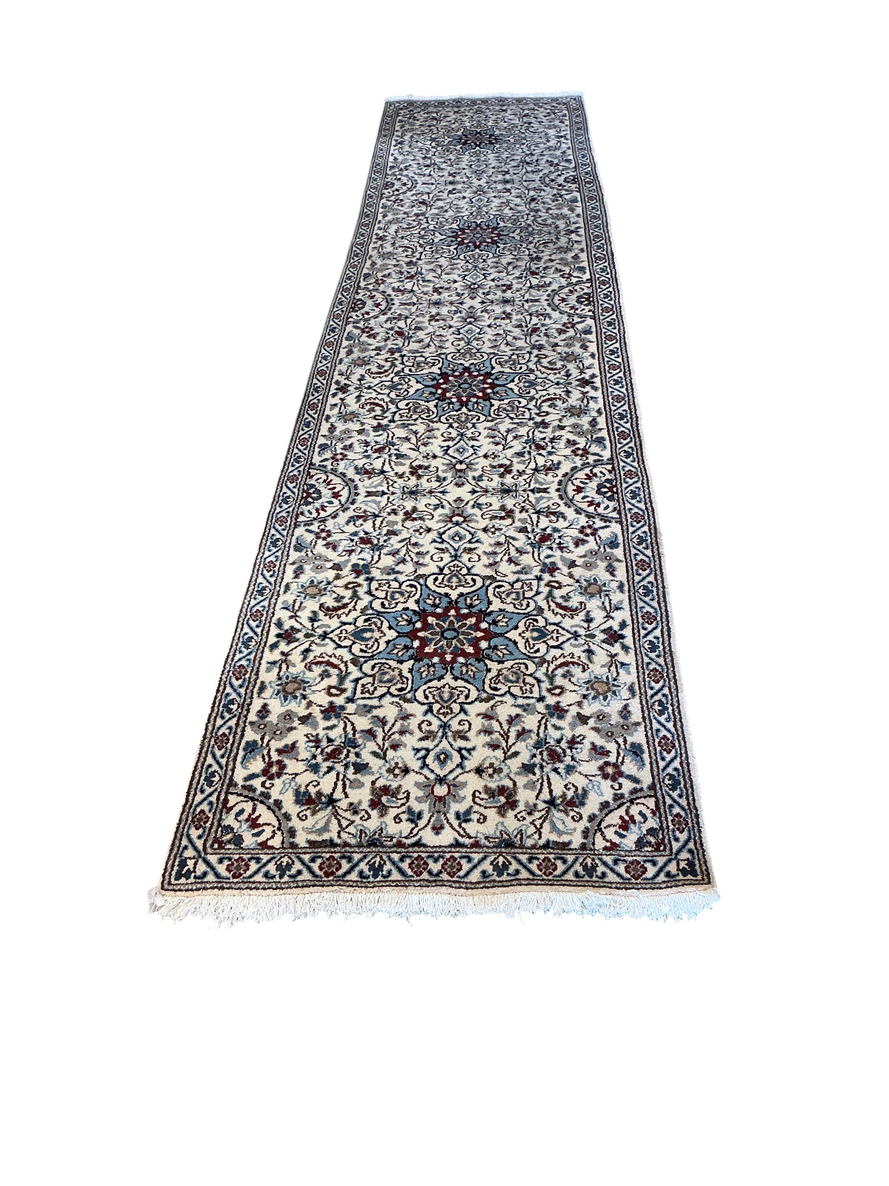 A Nain ivory ground runner, 386 x 86cm